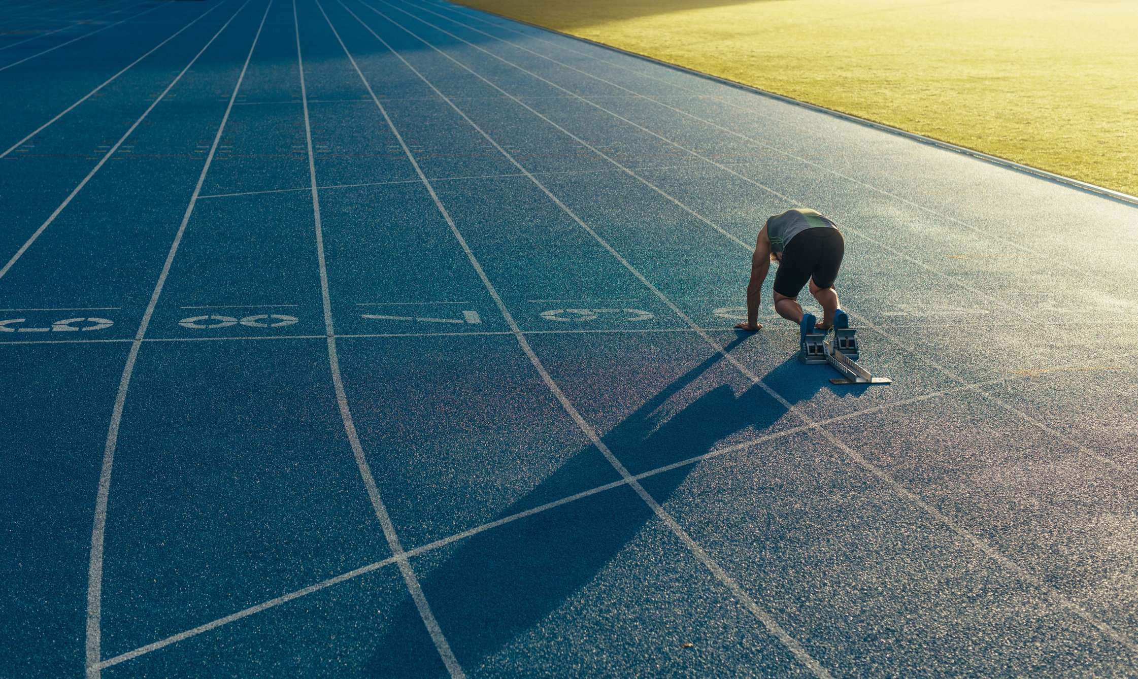 Sprinter on His Marks on a Running Track